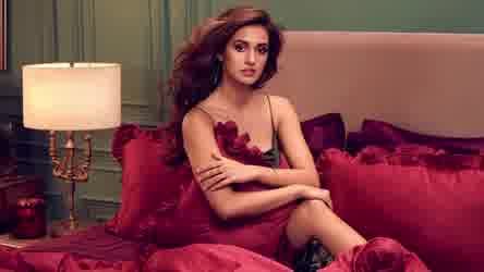 Disha Patani Shares Hot Photoshoot Posing On A Bed In Red Dress